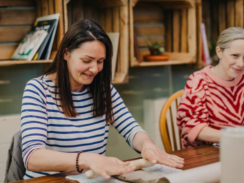 Woman hand building clay
